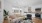 Spacious well lit kitchen with wood floors and stainless steel appliances