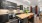Spacious well lit kitchen with wood floors and stainless steel appliances