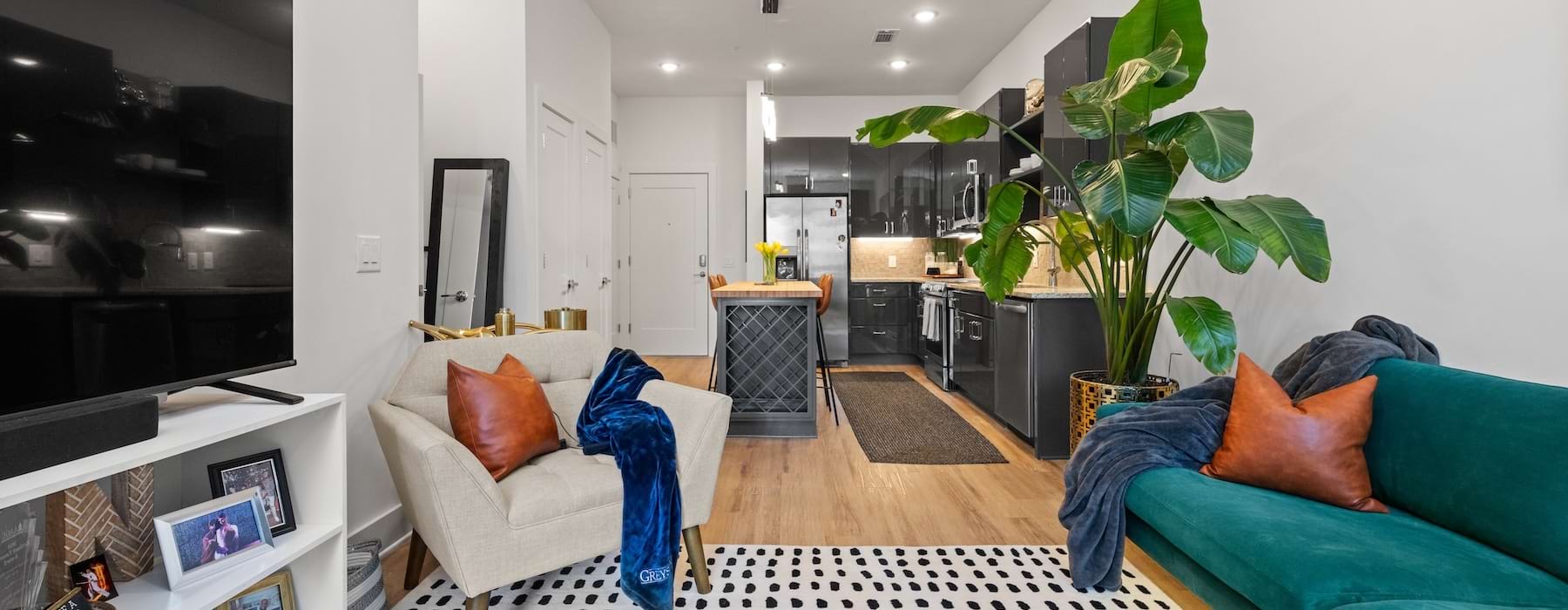 Large open living space with alot of natural light and wood floors