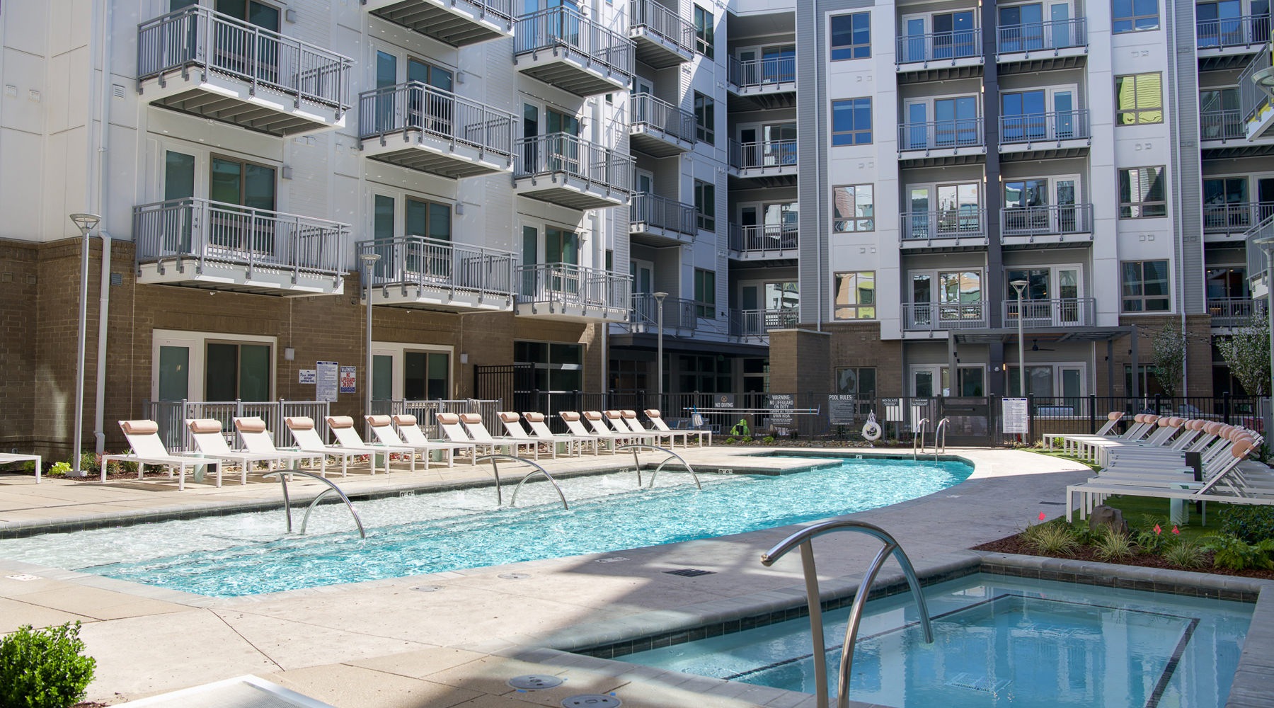 Pool Large pool with shaded seating and clubhouse access.
